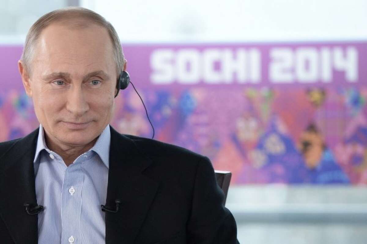 In this Friday, Jan. 17, 2014 photo made available by Presidential Press Service on Sunday, Jan. 19, 2014, Russian President Vladimir Putin listens to a translation during an interview to Russian and foreign media at the Russian Black Sea resort of Sochi, which will host Winter Olympic Games on Feb. 7, 2014. President Vladimir Putin once again has offered assurances to gays planning to attend the Sochi Olympics, but his arguments defending Russia?’s ban on homosexual ?“propaganda?” to minors show the vast gulf between how he understands the issues and how homosexuality is generally viewed in the West. In an interview with Russian and foreign television stations broadcast Sunday, Putin equated gays with pedophiles and spoke of the need for Russia to ?“cleanse?” itself of homosexuality as part of efforts to increase the birth rate. (AP Photo/RIA Novosti, Alexei Nikolsky, Presidential Press Service)
