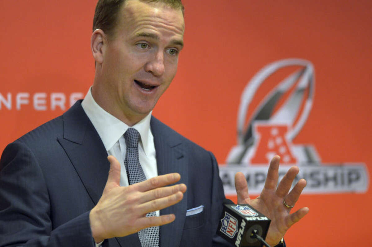 Denver Broncos quarterback Peyton Manning answers questions at the post game press conference after the AFC Championship NFL playoff football game in Denver, Sunday, Jan. 19, 2014. The Broncos defeated the Patriots 26-16 to advance to the Super Bowl. (AP Photo/Jack Dempsey)