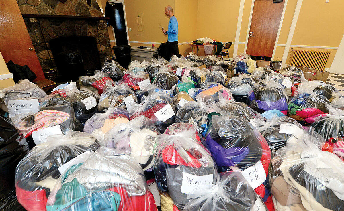 Hour photo / Erik Trautmann Over 100 bags of outerwear was donated to The Rowayton Community Association's first annual winter "Bundle Up Rowayton" clothing drive Saturday at the Rowayton Community Center to help benefit the Open Door Shelter in South Norwalk.