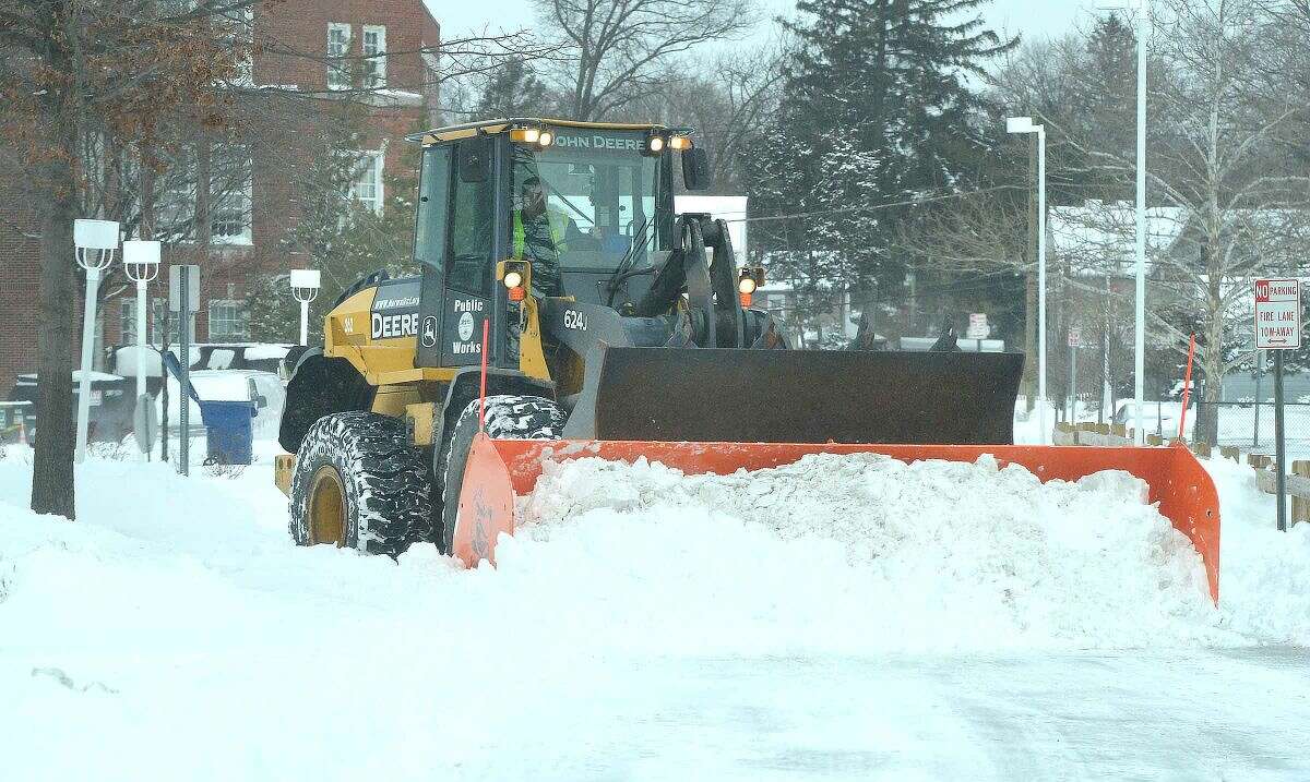 Hour Photo/Alex von Kleydorff The heavy snow removal equipment is working to clear the area at City Hall in Norwalk Tuesday