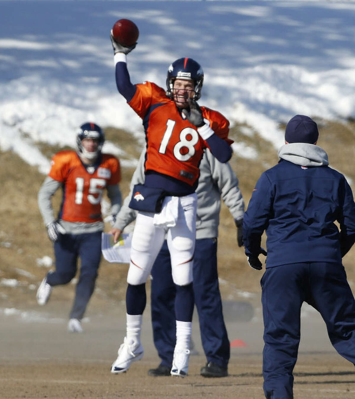 Denver Broncos quarterback Peyton Manning (18) throws a pass during NFL football practice at the team's training facility in Englewood, Colo., on Thursday, Jan. 23, 2014. The Broncos are scheduled to play the Seattle Seahawks in Super Bowl XLVIII on Feb. 2. (AP Photo/Ed Andrieski)