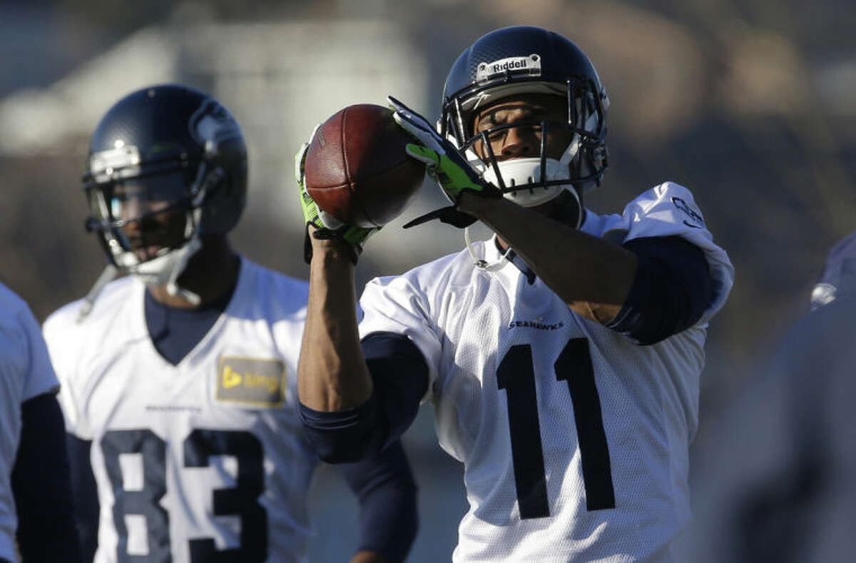 Seattle Seahawks wide receiver Percy Harvin (11) catches the football during warm-up drills before NFL football practice, Thursday, Jan. 23, 2014, in Renton, Wash. The Seahawks will play the Denver Broncos Feb. 2, 2014 in the Super Bowl. (AP Photo/Ted S. Warren)