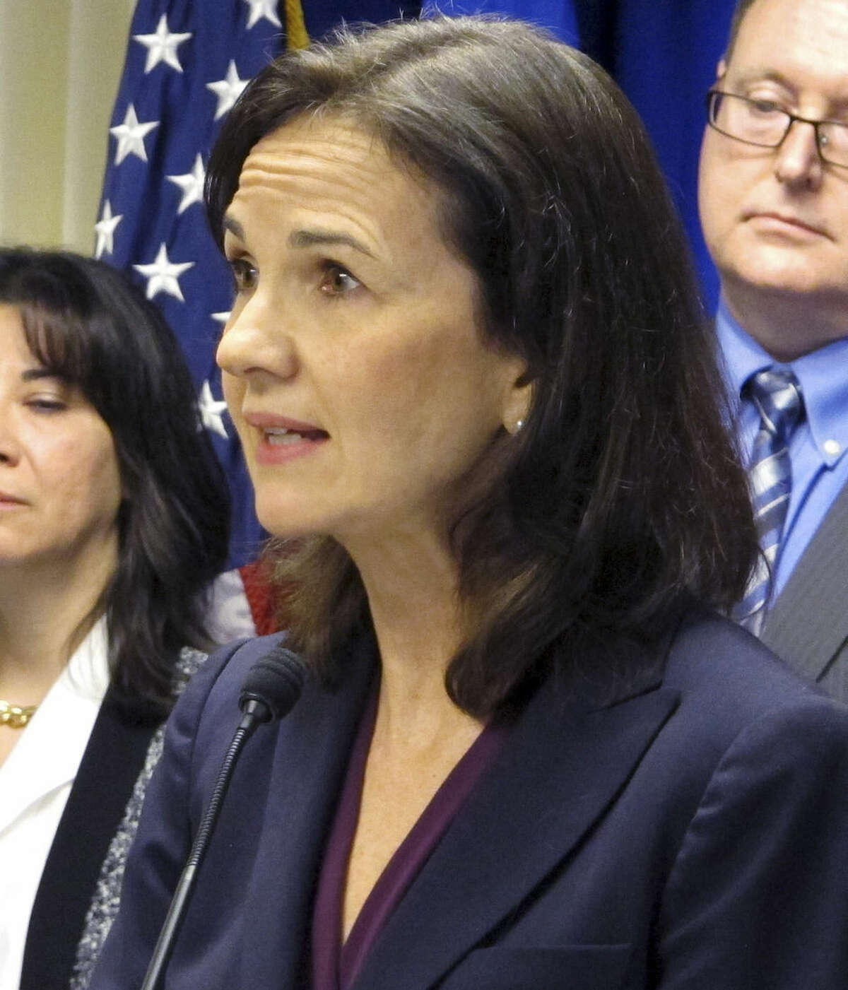 Deirdre Daly, the U.S. attorney for Connecticut, stands with other federal officials while announcing a new public corruption task force on Wednesday, Feb. 4, 2015, in New Haven, Conn. Daly said the problem of corruption in the state is persistent and troubling, given the large number of high-profile prosecutions over the past several years. (AP Photo/Dave Collins)