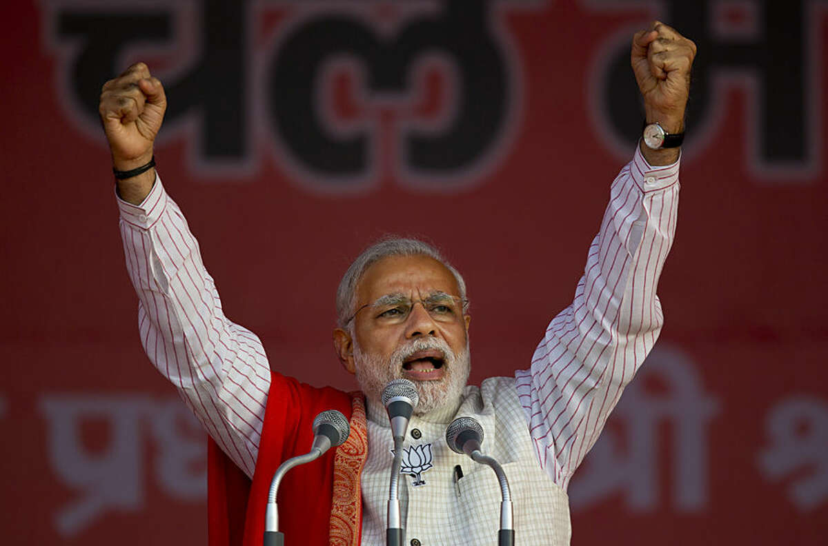 Indian Prime Minister Narendra Modi addresses an election campaign rally for his Bharatiya Janata Party (BJP) ahead of Delhi state election in New Delhi, India, Wednesday, Feb. 4, 2015. Delhi goes to the polls on Feb. 7. (AP Photo/Saurabh Das)