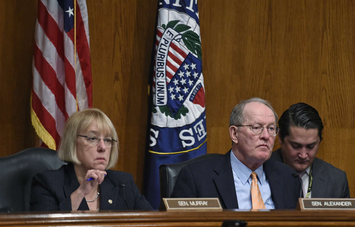 FILE - In this Jan. 21, 2015, file photo, Senate Health, Education, Labor and Pensions Committee Chairman Sen. Lamar Alexander, R-Tenn., sitting next to ranking member Sen. Patty Murray, D-Wash., listen to testimony during a hearing looking at ways to fix the No Child Left Behind law during a hearing on Capitol Hill in Washington. Outnumbered by Republicans, Democratic lawmakers are jockeying to get their views heard as Congress moves ahead on revising the much-maligned No Child Left Behind education law. (AP Photo/Susan Walsh, File)
