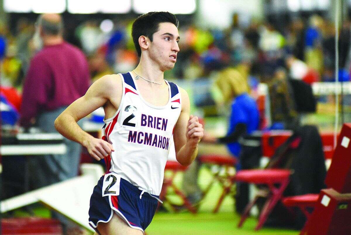 Hour photo/John Nash - Eric van der Els of Brien McMahon pulled off a rare distance triple at Saturday's CIAC State Open track meet, winning the 1,000, the 1,600 and 3,200 and helping the Senators place second to unofficial winner Danbury.