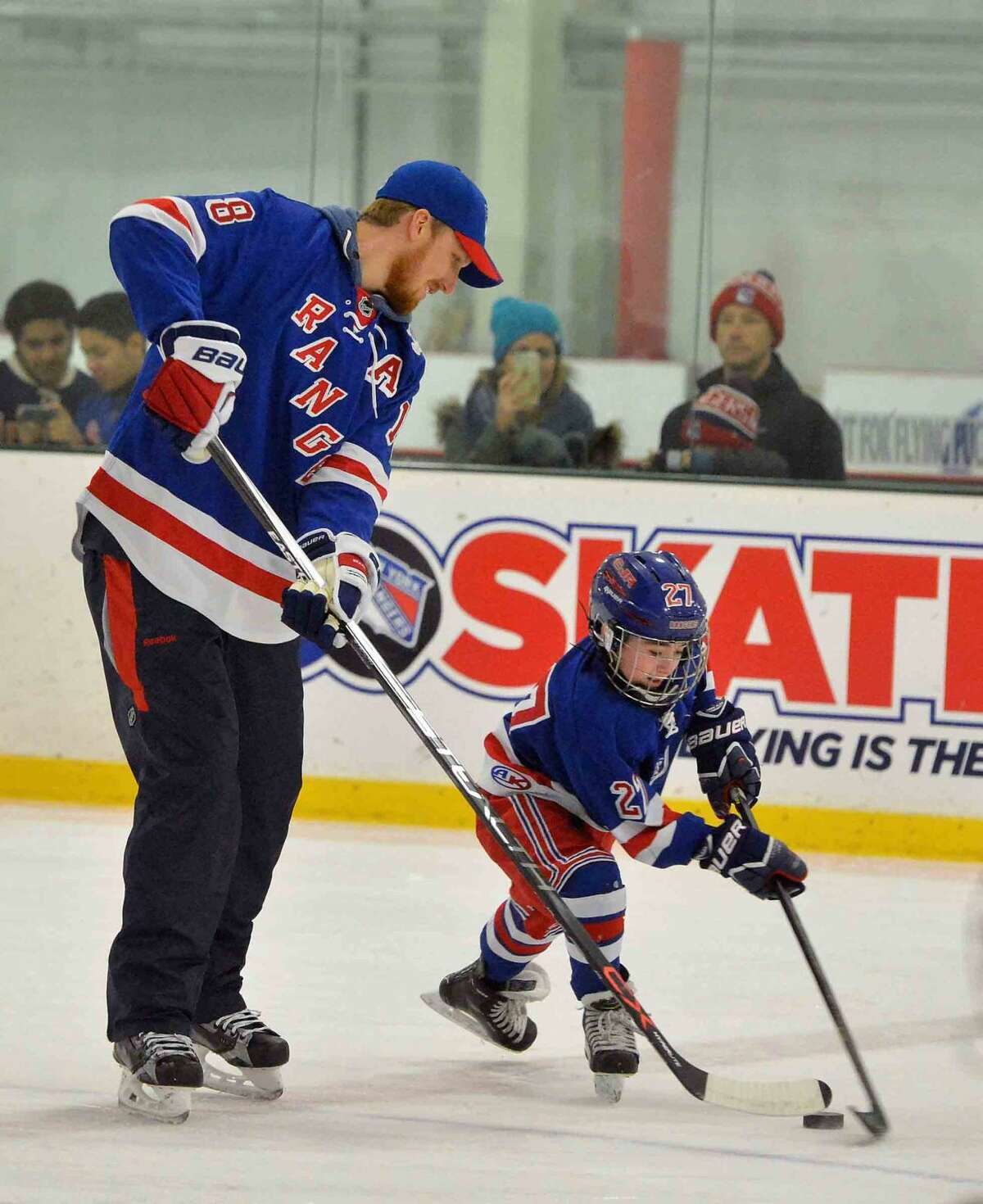 Hour Photo/Alex von Kleydorff. Ny Rangers defenseman Marc Staal works with kids during a clinic before the Game at SONO Ice House