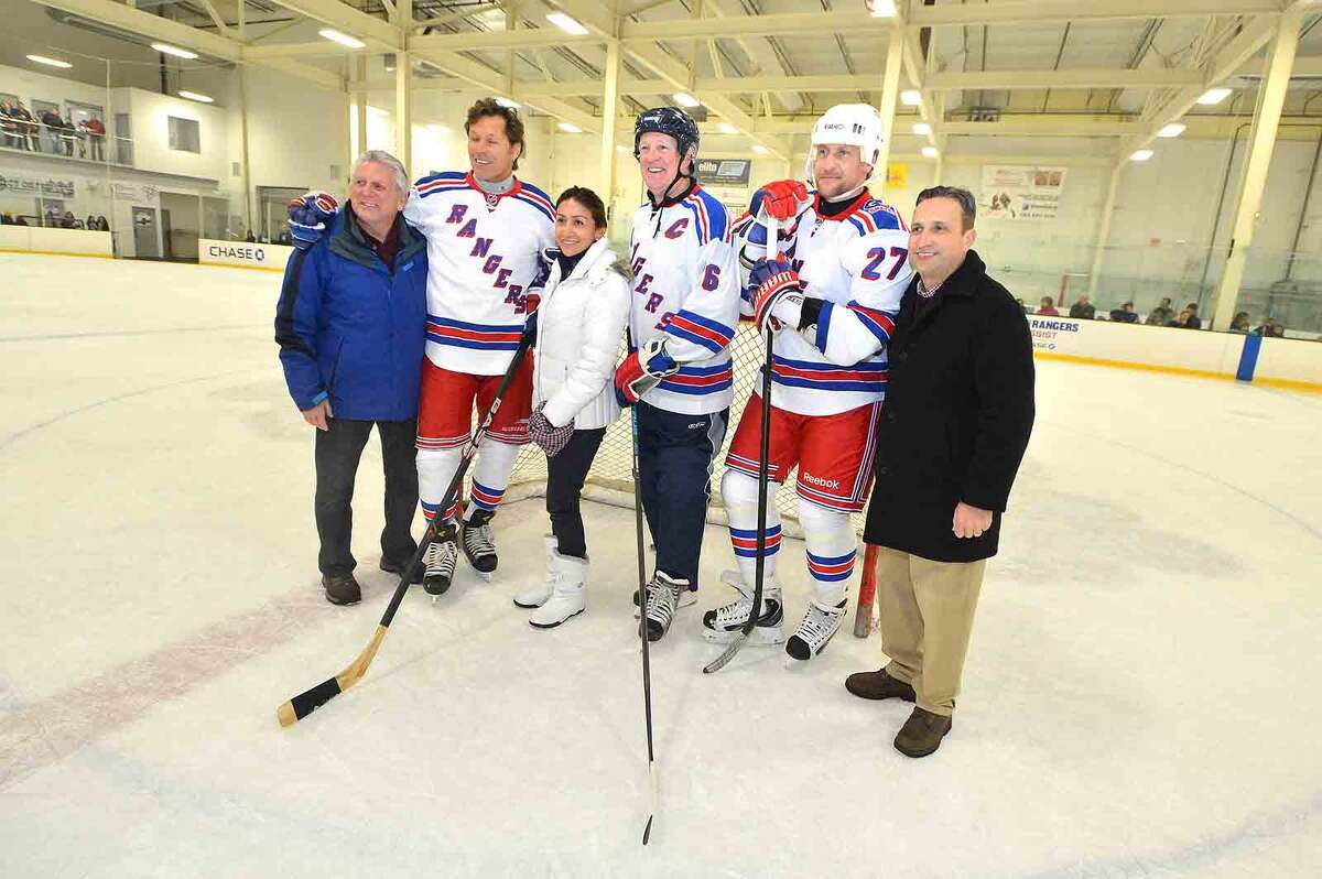 Hour Photo/Alex von Kleydorff Mayor Harry Rilling and wife Lucia join Bob Duff and Rangers players as NY Rangers current players and alumni hold hockey clinics and take to the ice at SONO Ice House with 'NY Rangers Assist' program to benefit Hockey in Norwalk Foundation
