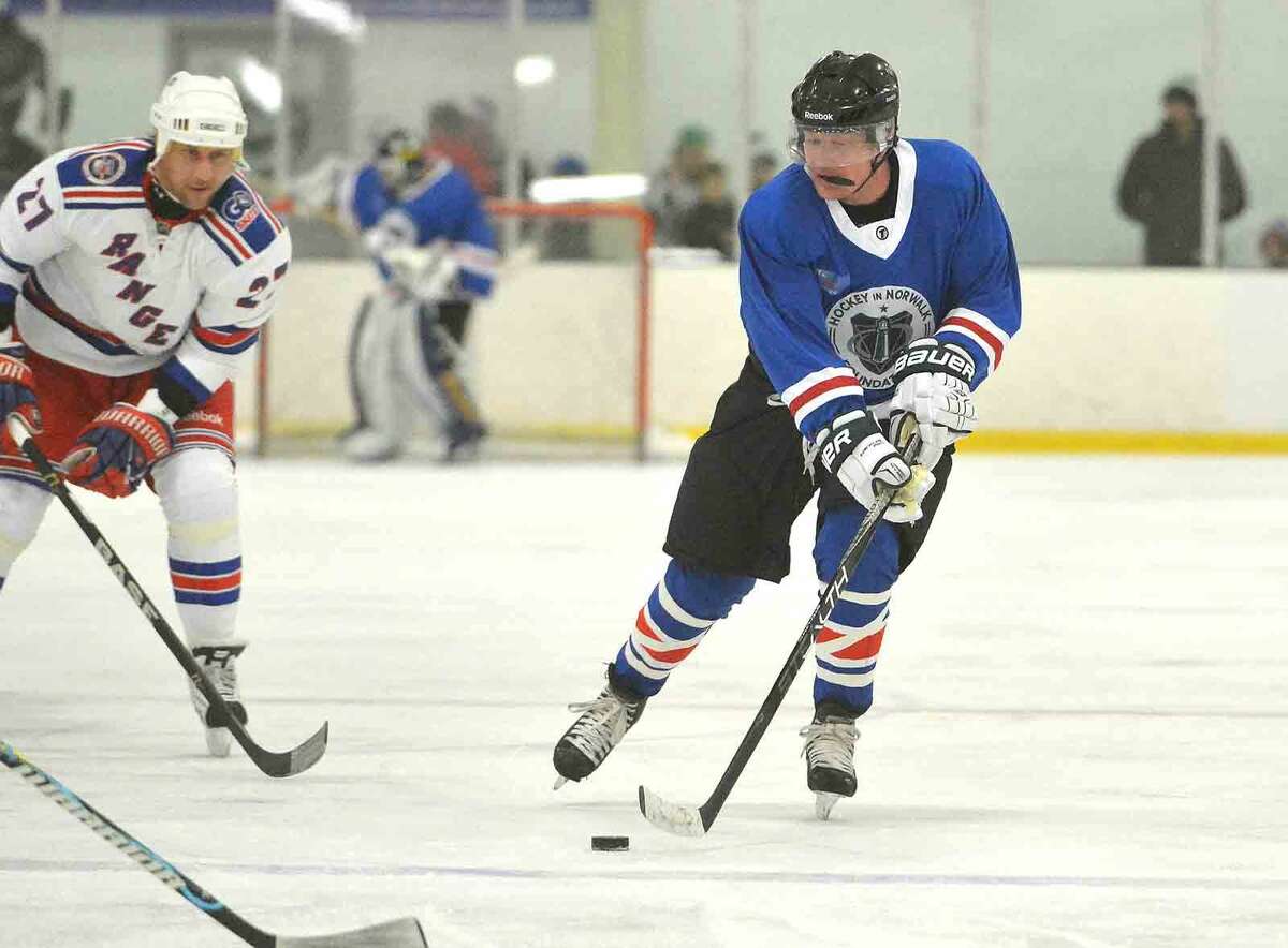 Hour Photo/Alex von Kleydorff Jeremy Salley moves the puck at SONO Ice House NY Rangers benefit