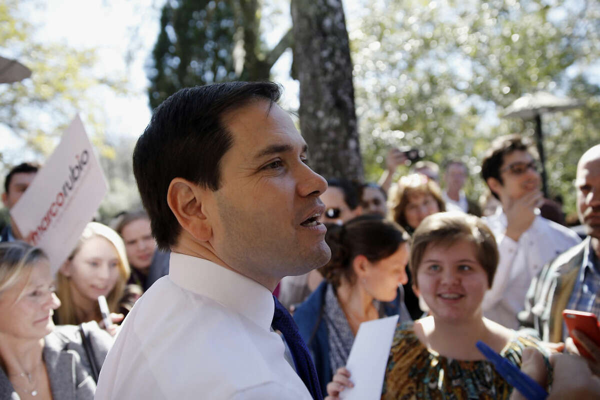 Republican presidential candidate, Sen. Marco Rubio, R-Fla. meets with attendees during a campaign stop, Tuesday, Feb. 16, 2016, in Summerville, S.C. (AP Photo/Matt Rourke)