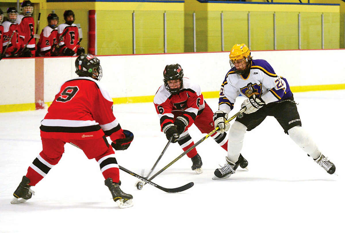Hour photo / Erik Trautmann Westhill High School co op hockey team takes on Farfield Warde in their regular season FCIAC game Saturday at Terry Connors Rink in Stamford.