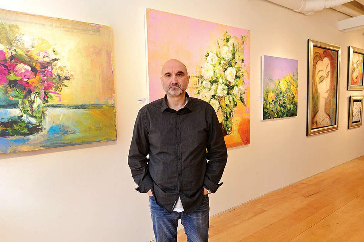 Hour photo / Erik Trautmann Claude Villani, owner of Gallerie SoNo, has reservations about unsanctioned public displays of artwork like was seen this week in South Norwalk.
