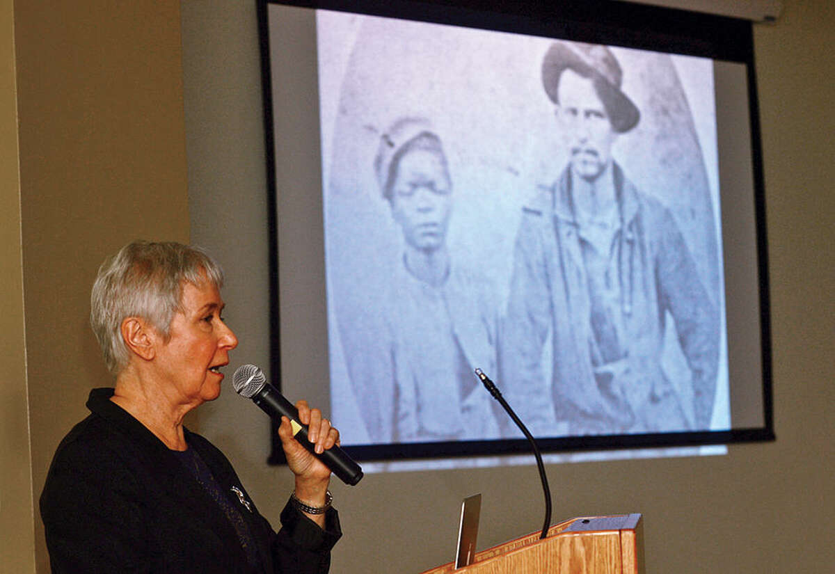 Hour photo / Erik Trautmann Norwalk resident and author Dorothy Mobilia recounts a little-known story about the friendship between a former slave and a Union soldier at the end of the Civil War from her book, "How Jimmy John Won His Cloak of Freedom", in the first of a series of Black History Month presentations at South Norwalk Branch Library Saturday.