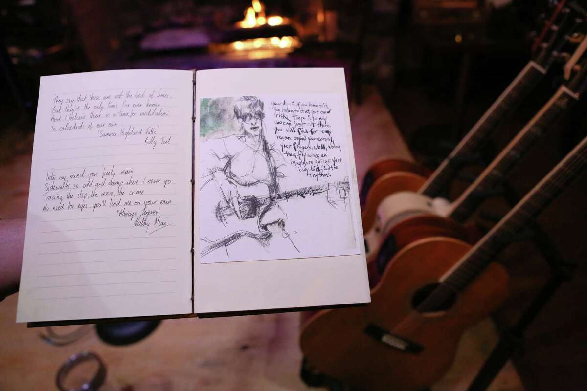 Once every few weeks, musician Kathy Muir, of Stamford, brings together a few musicians from across Connecticut, interviews them and has them put quotes from a favorite song or two in a sketchbook. As they play live, a sketch artist sketches them into the book, as shown.