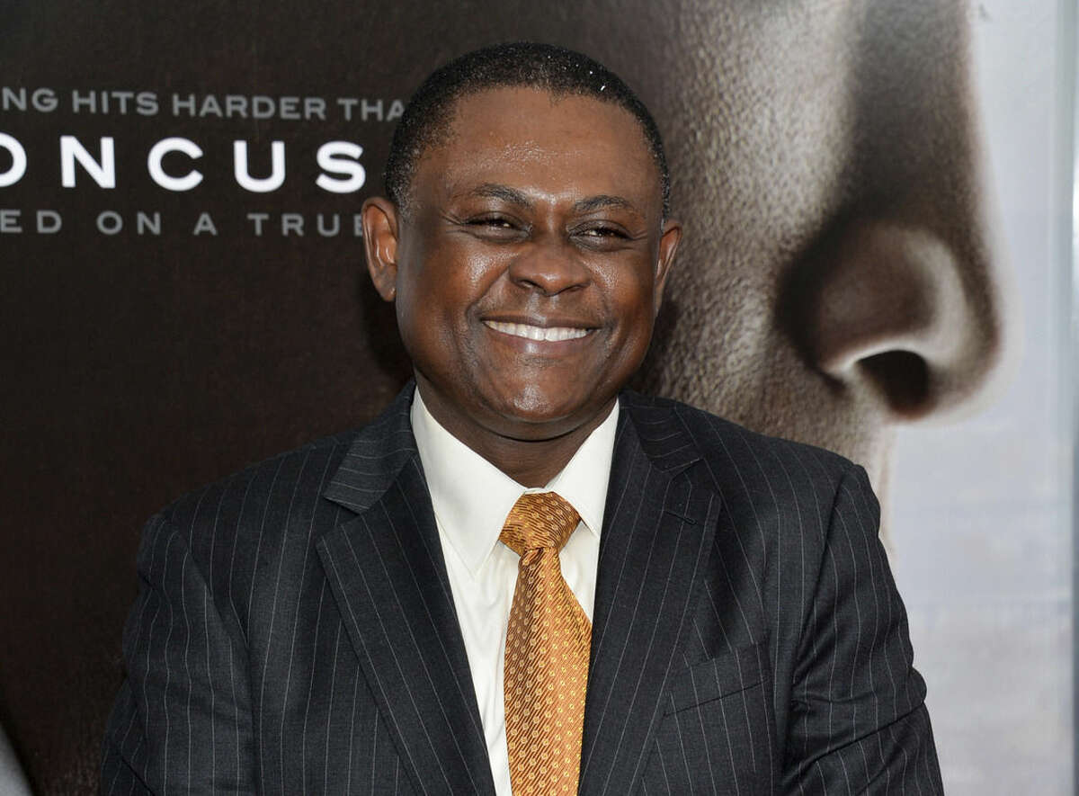 FILE - In this Dec. 16, 2015 file photo, Dr. Bennet Omalu attends a special screening of "Concussion" in New York. Omalu, forensic pathologist who identified the brain disease CTE afflicting numerous football players and was played by Will Smith in the movie "Concussion," has a six-figure deal with the Christian publisher Zondervan for a memoir. (Photo by Evan Agostini/Invision/AP, File)