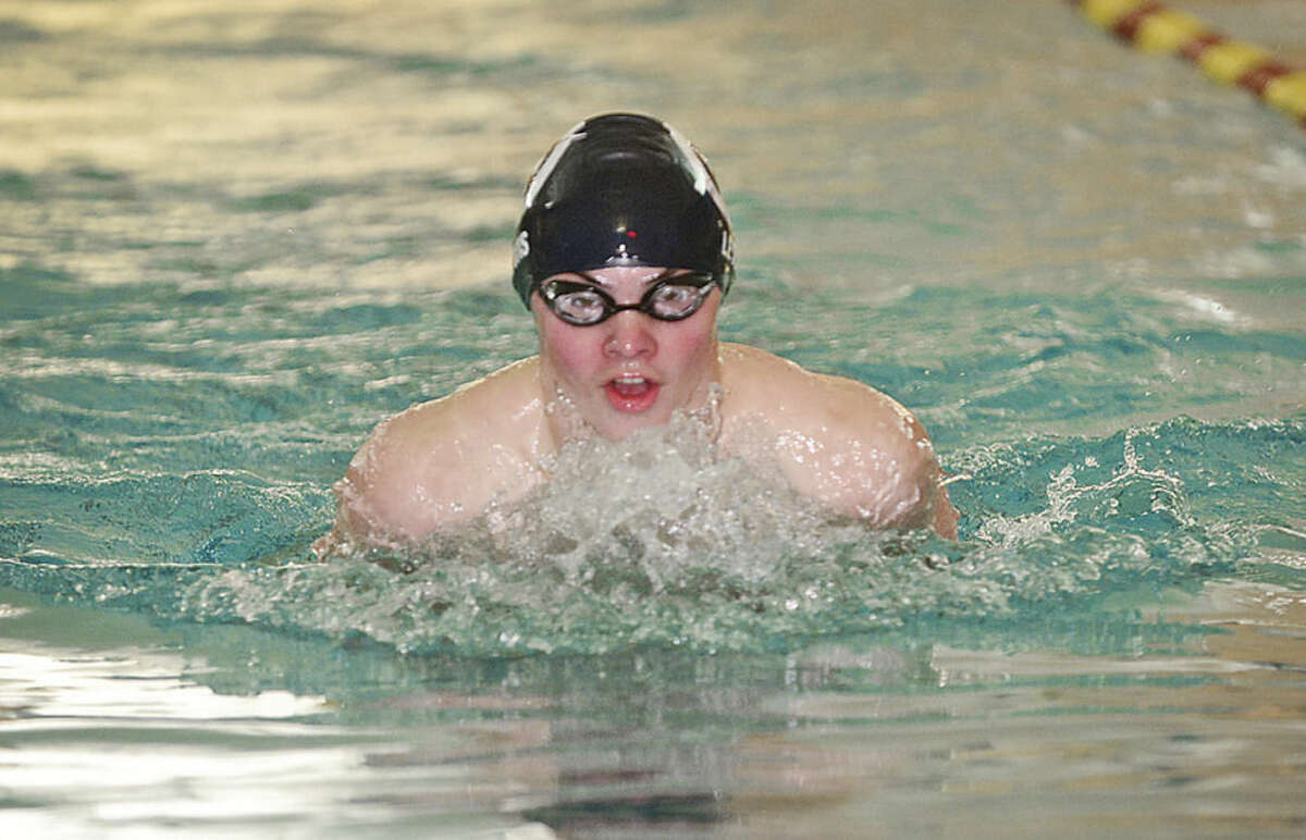 Hour photo/Erik Trautmann Wilton High School boys swimmer Jack Lewis swims the 100 breaststoke against the Stamford/Westhill team Friday at the Wilton Y. Results of the meet were not made available to The Hour.