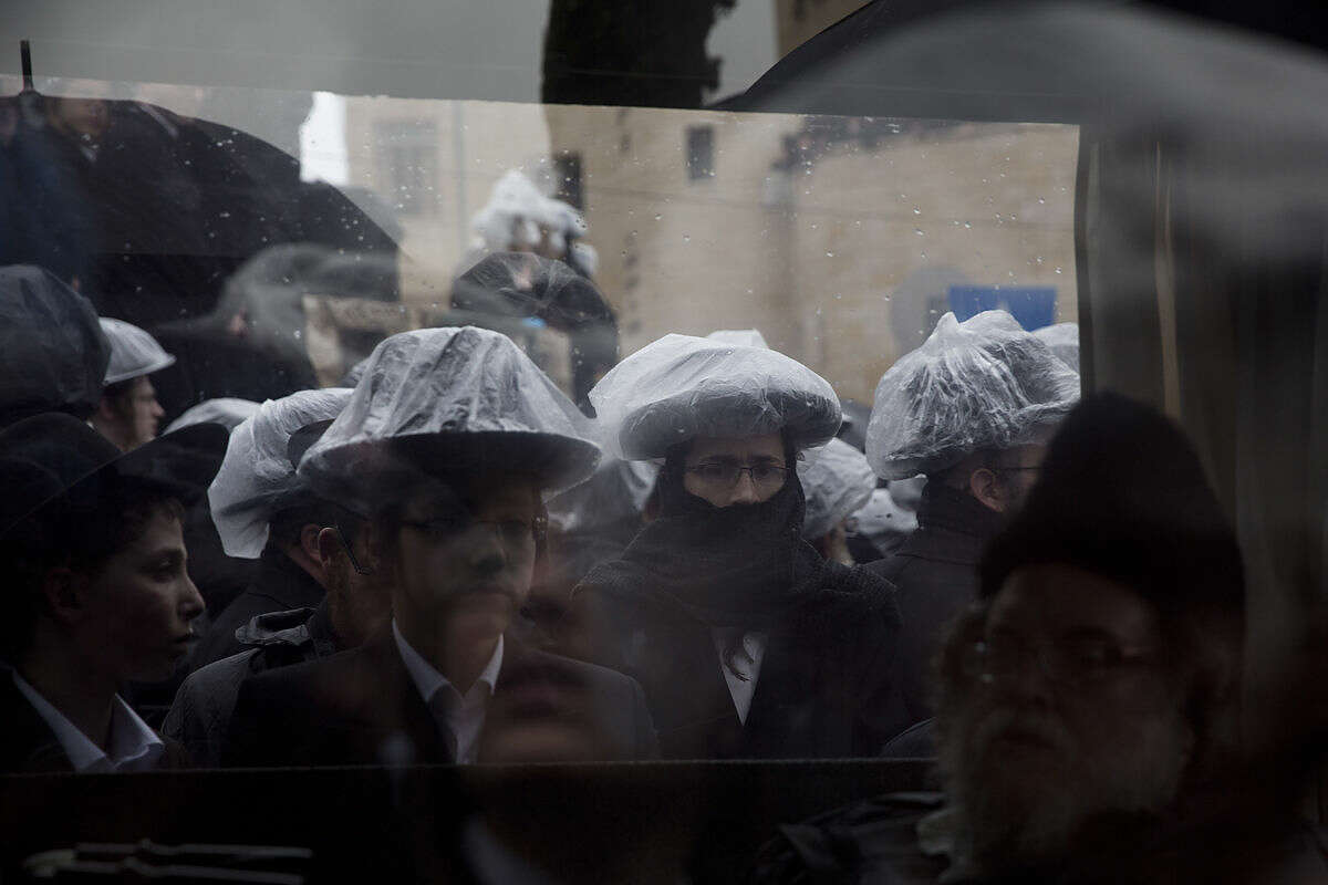 Ultra-Orthodox Jews mourn for prominent Jewish Rabbi Yochanan Sofer of the Erlau dynasty, during his funeral in Jerusalem, Monday, Feb. 22, 2016. Sofer survived the Holocaust, he represented the Erlau Hasidic dynasty, founded in Hungary. He was 93. (AP Photo/Ariel Schalit)