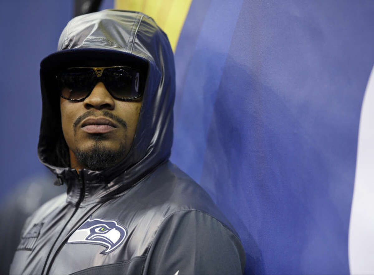 Seattle Seahawks' Marshawn Lynch stands against a wall during media day for the NFL Super Bowl XLVIII football game Tuesday, Jan. 28, 2014, in Newark, N.J. (AP Photo/Matt Slocum)