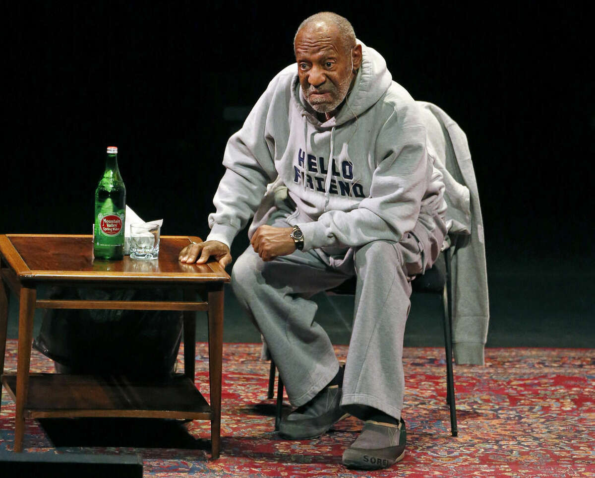 FILE - In this Jan. 17, 2015 file photo, comedian Bill Cosby performs at the Buell Theater in Denver. Cosby is scheduled to perform his comedy routine at Boston's Wilbur Theater Sunday, Feb. 8, 2015. He faces sexual assault accusations from several women, with some of the claims dating back decades. He has denied the allegations through his attorney and has never been charged with a crime. (AP Photo/Brennan Linsley, File)
