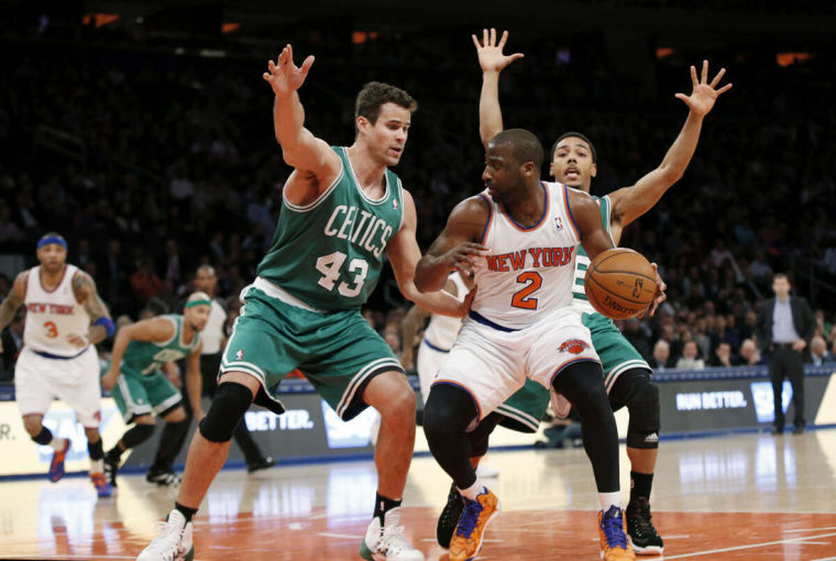 Boston Celtics center Kris Humphries (43) defends New York Knicks guard Raymond Felton (2) in the first half of an NBA basketball game at Madison Square Garden in New York, Tuesday, Jan. 28, 2014. (AP Photo/Kathy Willens)