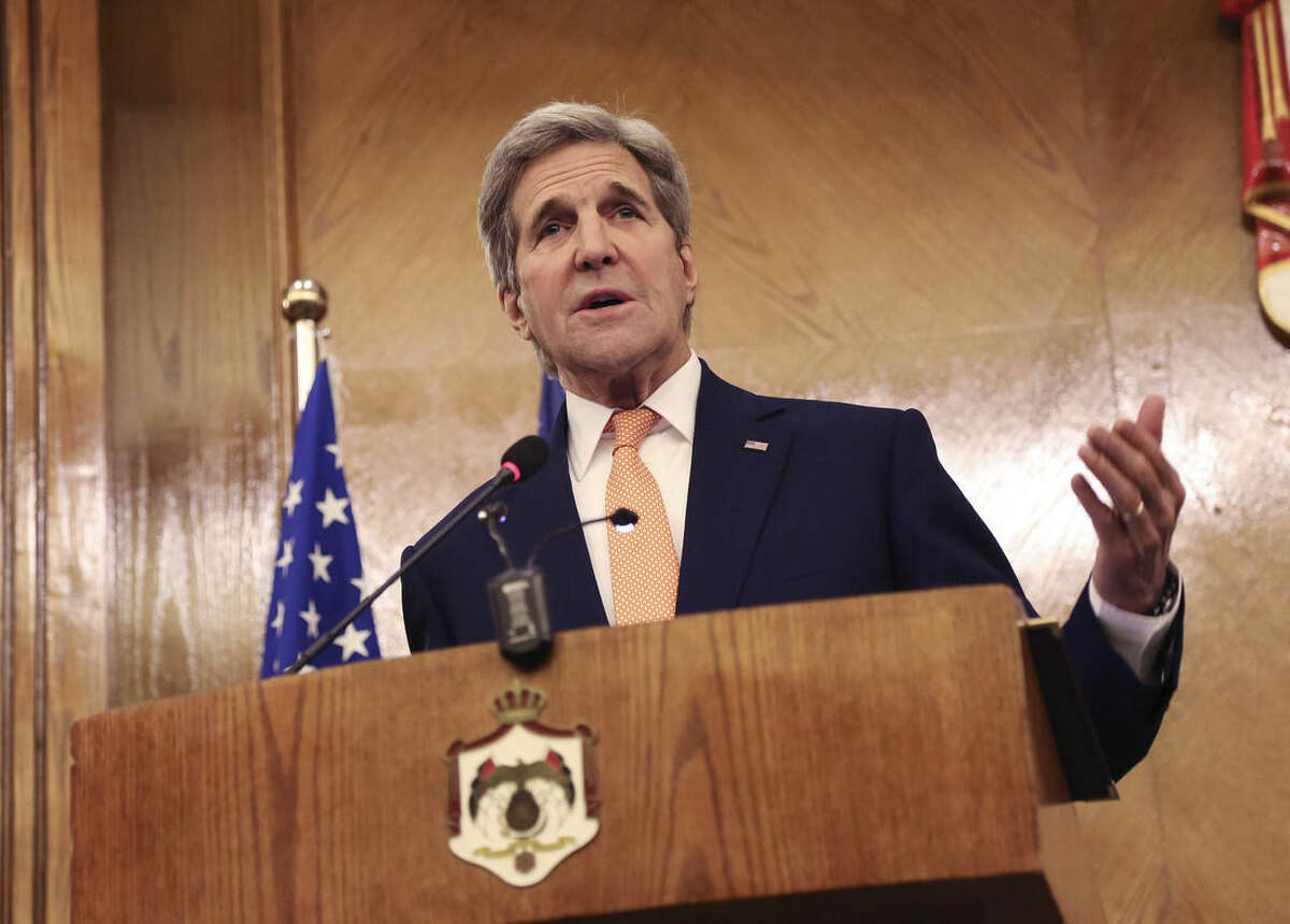 Secretary of State John Kerry gestures during a joint press conference with his Jordanian counterpart Nasser Judeh (unseen) in Amman, Jordan, Sunday, Feb. 21, 2016. John Kerry said Sunday that a "provisional agreement" has been reached on a Syrian cease-fire that could begin in the next few days, but he acknowledged that it’s not finalized and all parties might not automatically comply. (AP Photo/Raad Adayleh)