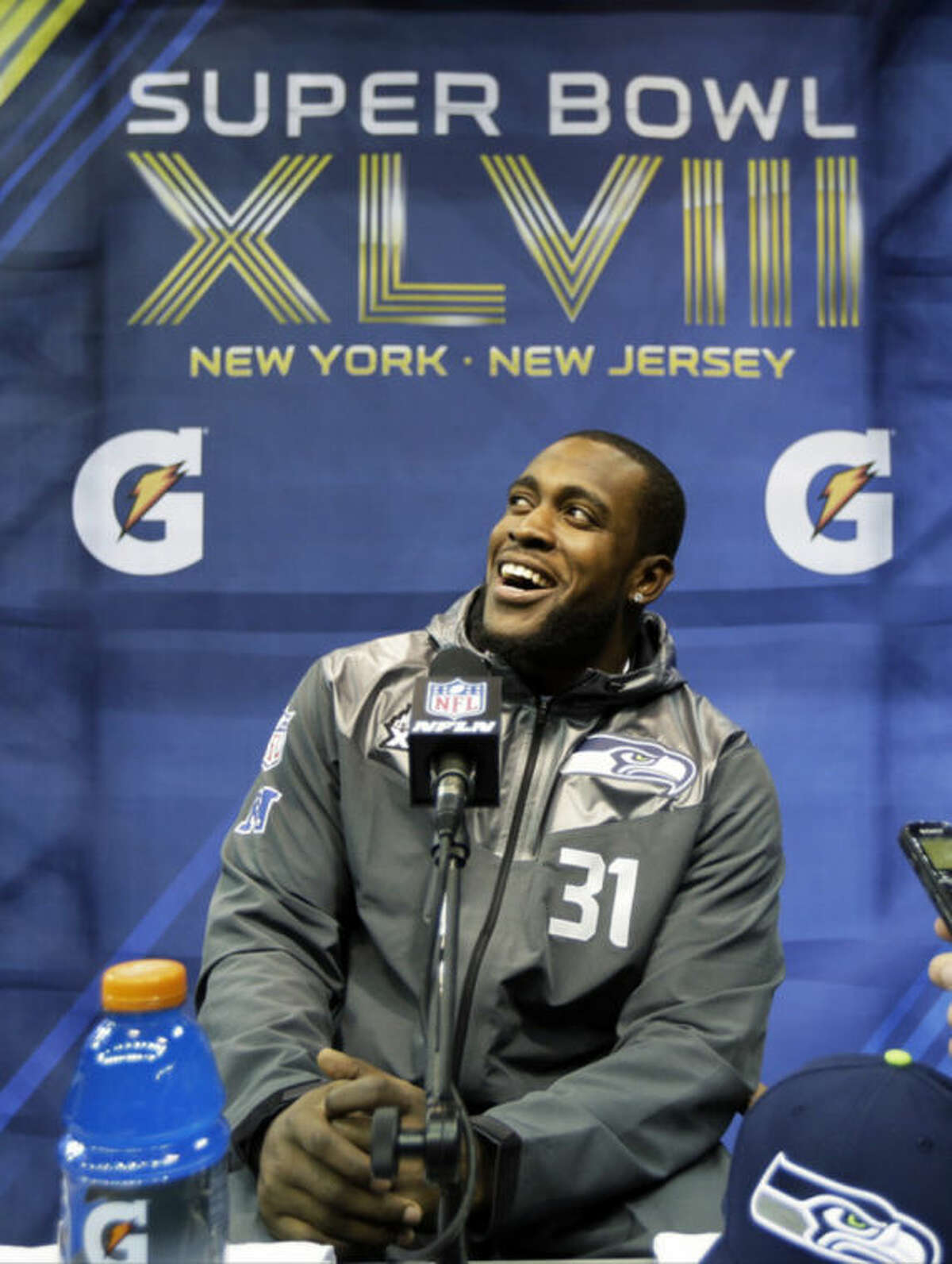 Seattle Seahawks' Kam Chancellor answers a question during media day for the NFL Super Bowl XLVIII football game Tuesday, Jan. 28, 2014, in Newark, N.J. (AP Photo/Jeff Roberson)