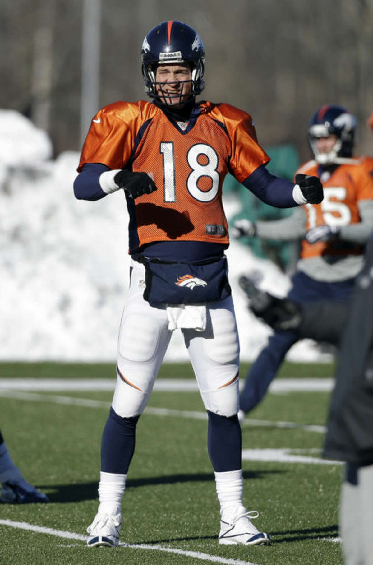 Denver Broncos quarterback Peyton Manning (18) stretches during practice Wednesday, Jan. 29, 2014, in Florham Park, N.J. The Broncos are scheduled to play the Seattle Seahawks in the NFL Super Bowl XLVIII football game Sunday, Feb. 2, in East Rutherford, N.J. (AP Photo/Mark Humphrey)