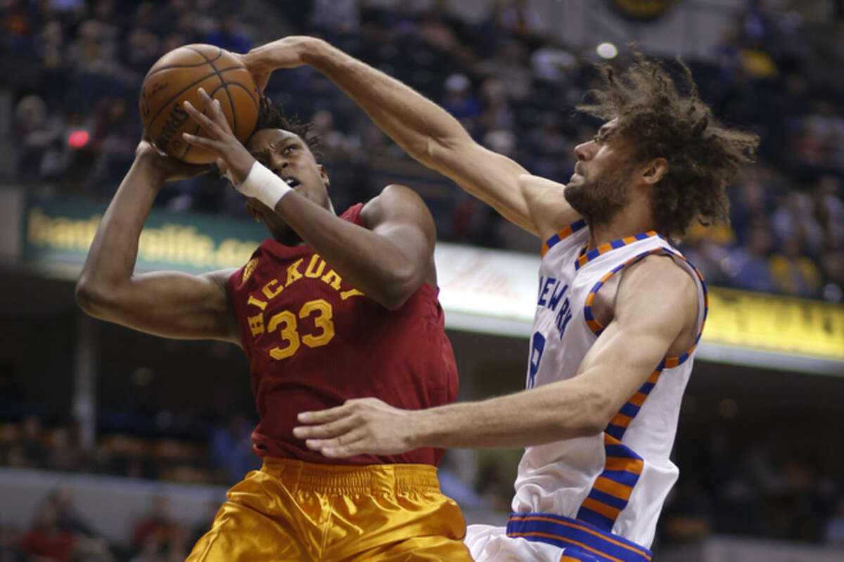 Indiana Pacers forward Myles Turner, left, is fouled by New York Knicks center Robin Lopez (8) during the second half of an NBA basketball game in Indianapolis, Wednesday, Feb. 24, 2016. The Pacers won 108-105. (AP Photo/AJ Mast)