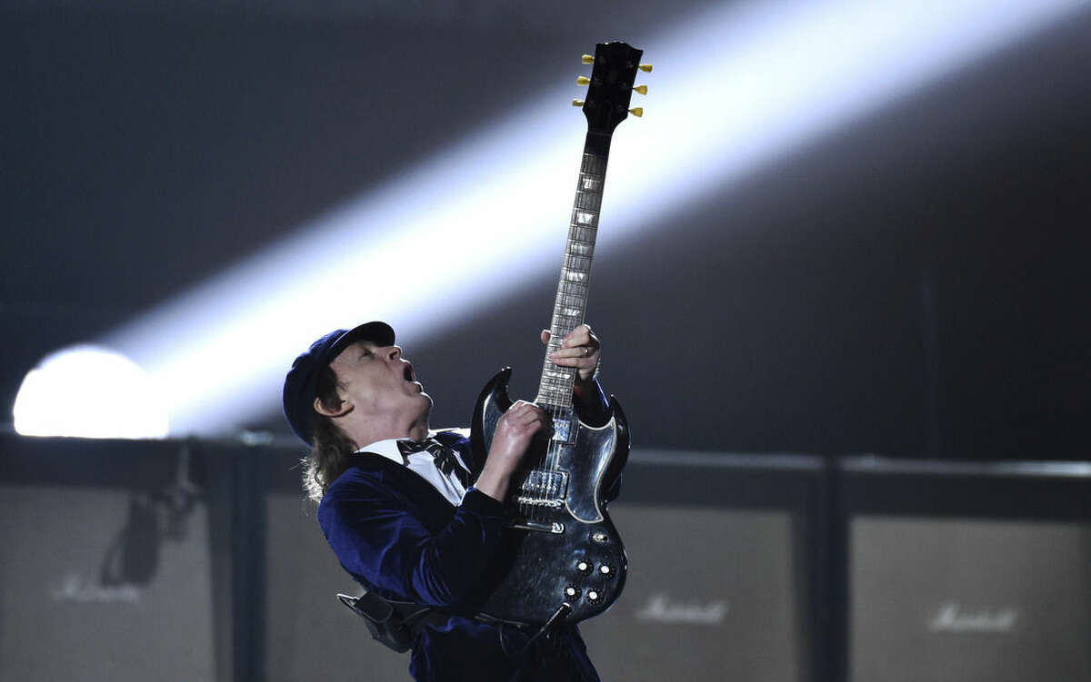 Angus Young of AC/DC performs at the 57th annual Grammy Awards on Sunday, Feb. 8, 2015, in Los Angeles. (Photo by John Shearer/Invision/AP)