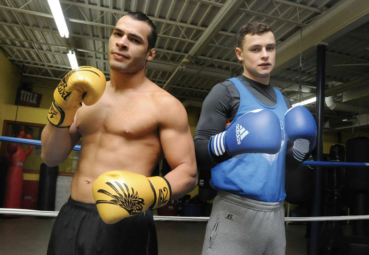 Vinicius De Jesus, left, and Ihor Laba, right, at Heavy Hitting Boxing and Fitness in Stamford. The two, both immigrants, are among the gym’s best boxing prospects.