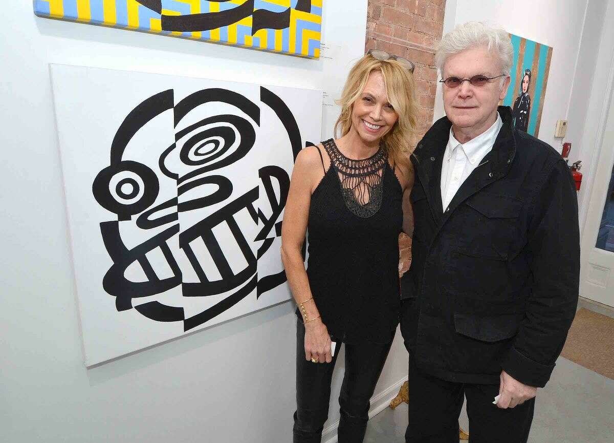Hour Photo/Alex von Kleydorff Gallery owner Cabell Molina with artist Frank Foster Post at one of his pieces at the opening of the new Love Art gallery and Studio in SONO