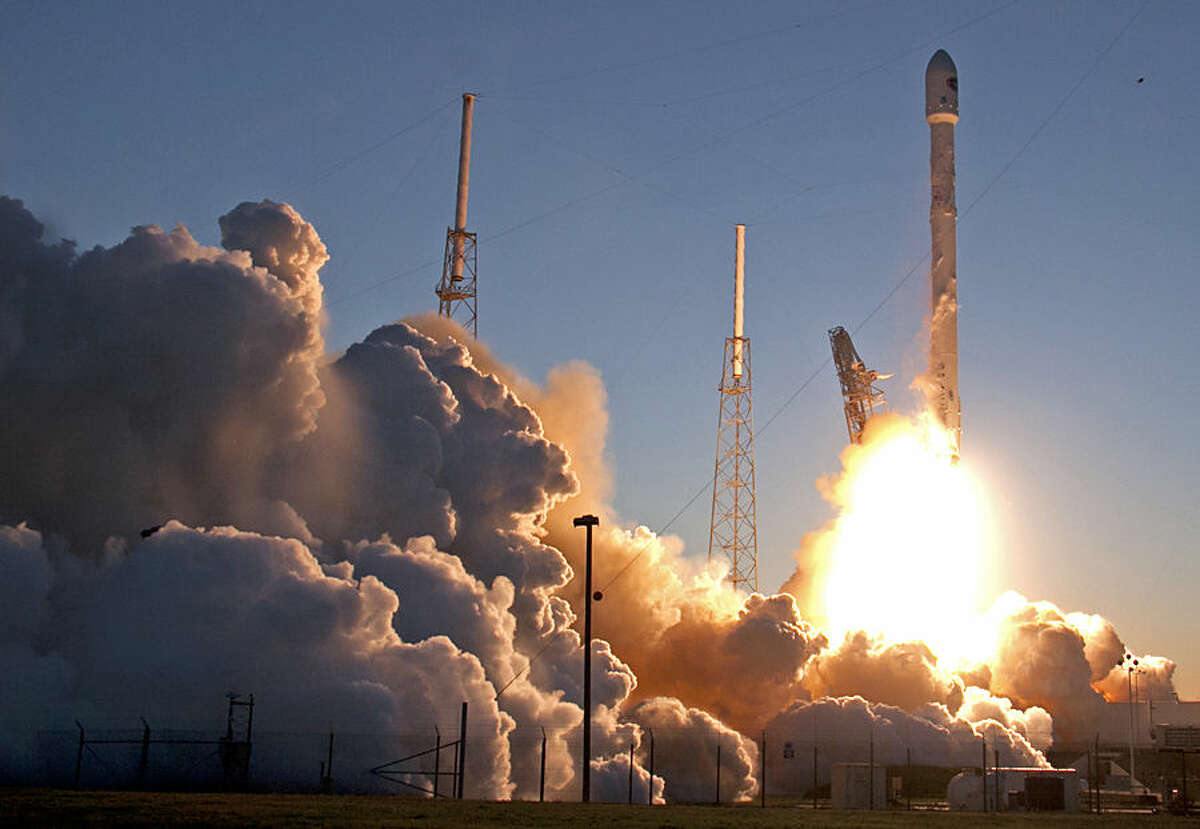 An unmanned Falcon 9 SpaceX rocket lifts off from launch complex 40 at the Cape Canaveral Air Force Station, Wednesday, Feb. 11, 2015, in Cape Canaveral, Fla. On board is the Deep Space Climate Observatory, which will head toward a solar-storm lookout point a million miles away. (AP Photo/John Raoux)