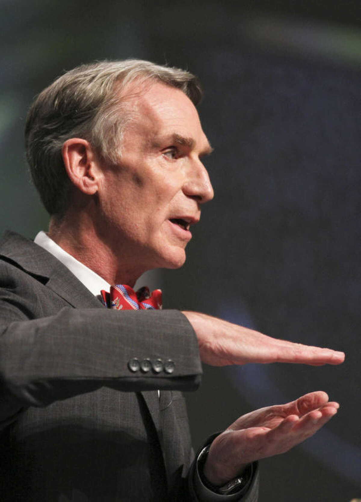 TV's "Science Guy" Bill Nye speaks during a debate on evolution with Creation Museum head Ken Ham, not shown, at the Creation Museum Tuesday, Feb. 4, 2014, in Petersburg, Ky. Ham believes the Earth was created 6,000 years ago by God and is told strictly through the Bible. Nye says he is worried the U.S. will not move forward if creationism is taught to children. (AP Photo/The Courier-Journal, Matt Stone) NO SALES; MAGS OUT; NO ARCHIVE; MANDATORY CREDIT