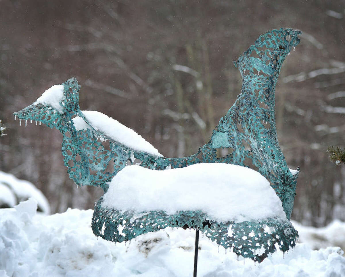 Hour Photo/Alex von Kleydorff This metal sculpture of a bird is covered in snow and icicles from its beak in the sculpture garden at The Silvermine Guild Arts Center on Wednesday
