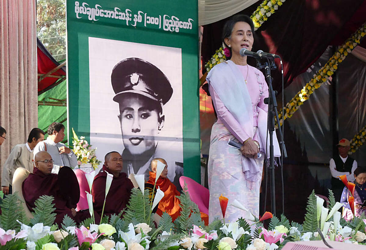Myanmar Opposition Leader Aung San Suu Kyi speaks during a ceremony to mark the 100th birthday anniversary of her late father, Gen. Aung San, at Nat Mauk township, native place of her father, Magwe Division, central Myanmar, Friday, Feb.13, 2015. Commemorations are held all across the country to celebrate the 100th year birth anniversary of the late independence hero Gen. Aung San, father of Myanmar’s democracy icon Aung San Suu Kyi. Photography and painting exhibitions, performances and fairs are being held for several days to mark the 100-year birthday of Aung San. (AP Photo/Khin Maung Win)