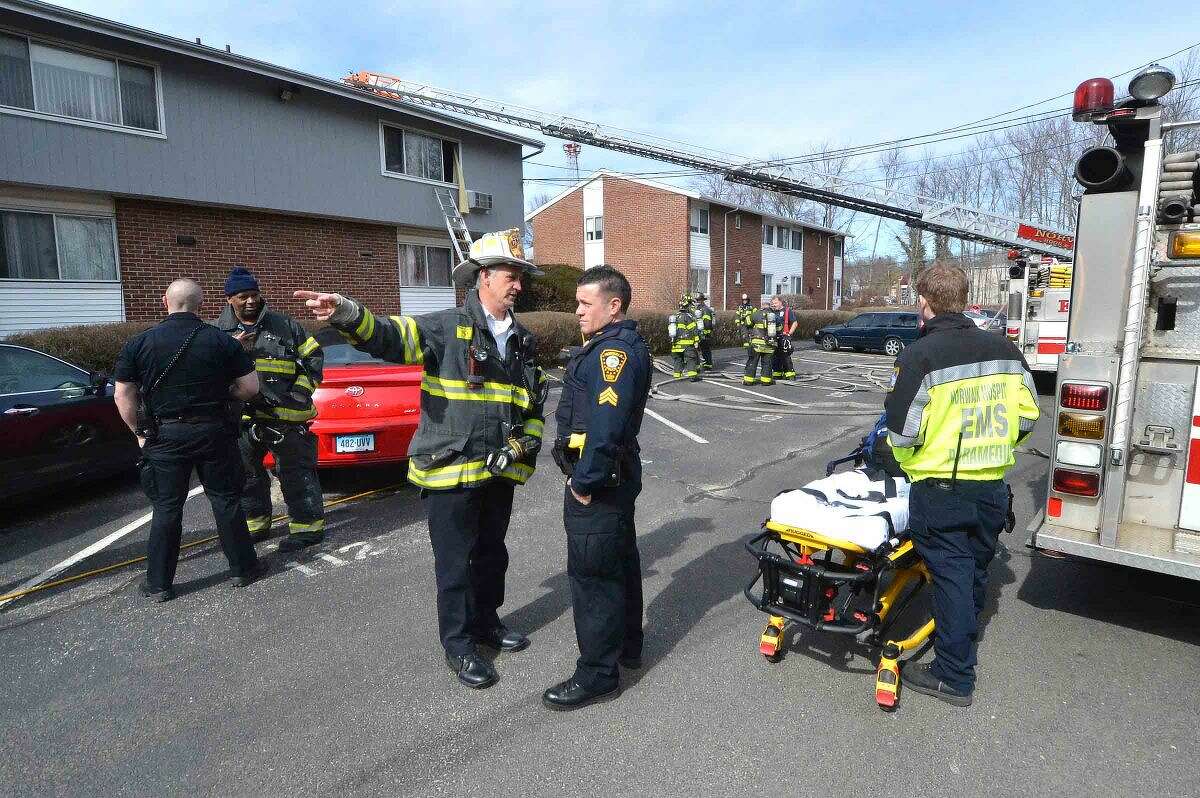 Hour Photo/Alex von Kleydorff Norwalk Fire , Police and Paramedics respond to a fire in a second story condo in the Nor-West complex on County St on Wednesday morning.