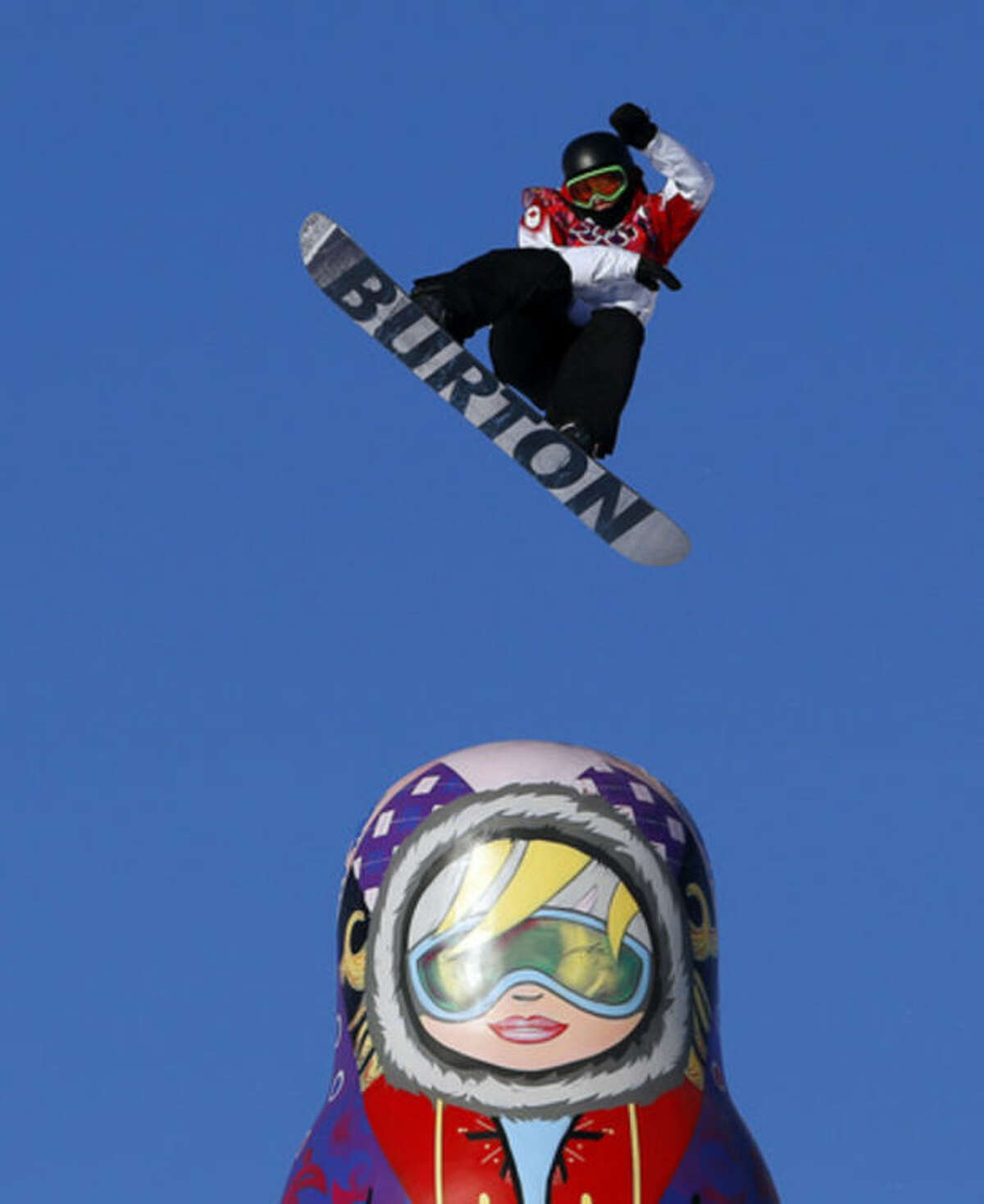 Canada's Mark McMorris takes a jump during the men's snowboard slopestyle semifinal at the Rosa Khutor Extreme Park, at the 2014 Winter Olympics, Saturday, Feb. 8, 2014, in Krasnaya Polyana, Russia. (AP Photo/Sergei Grits)