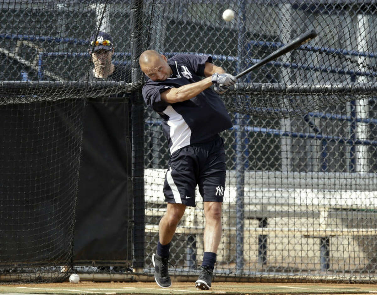 New York Yankees shortstop Derek Jeter hits the baseball during practice at the Yankees' minor league facility Wednesday, Feb. 12, 2014, in Tampa, Fla. Jeter says he will retire after this season. Jeter posted a long letter on his Facebook account Wednesday, Feb. 12, 2014, saying the 2014 will be his last year playing professional baseball.(AP Photo/Chris O'Meara)