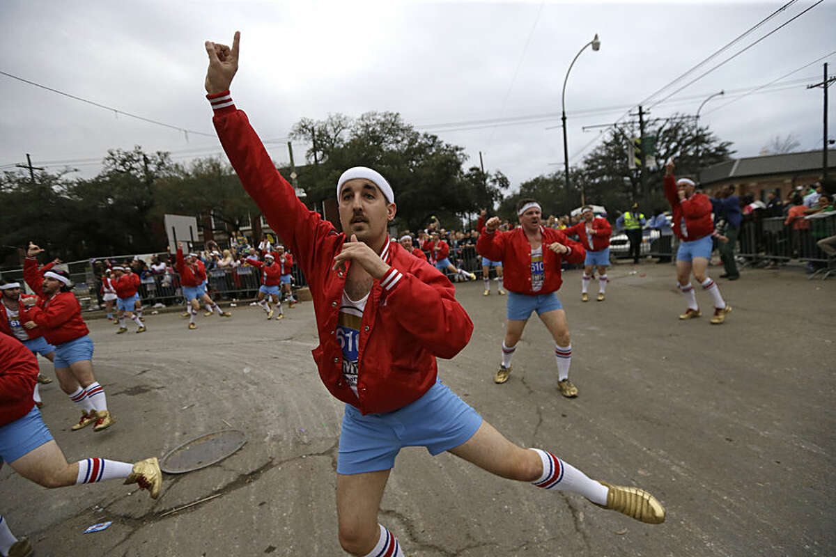 Members of the all-male dance group "The 610 Stompers" perform during the Krewe of Proteus Mardi Gras Parade in New Orleans, Monday, Feb. 16, 2015. The day is known as Lundi Gras, the day before Mardi Gras. (AP Photo/Gerald Herbert)