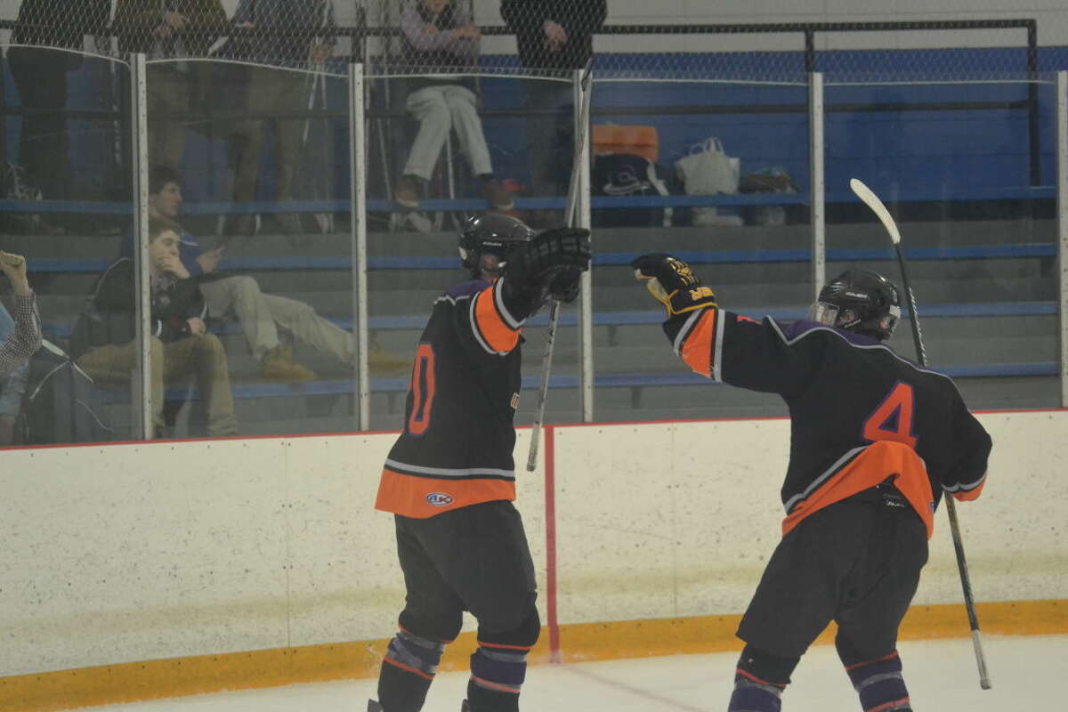 Westhill-Stamford's Nick Rich celebrates his first goal of the game with teammates Cooper Healy on Thursday night.