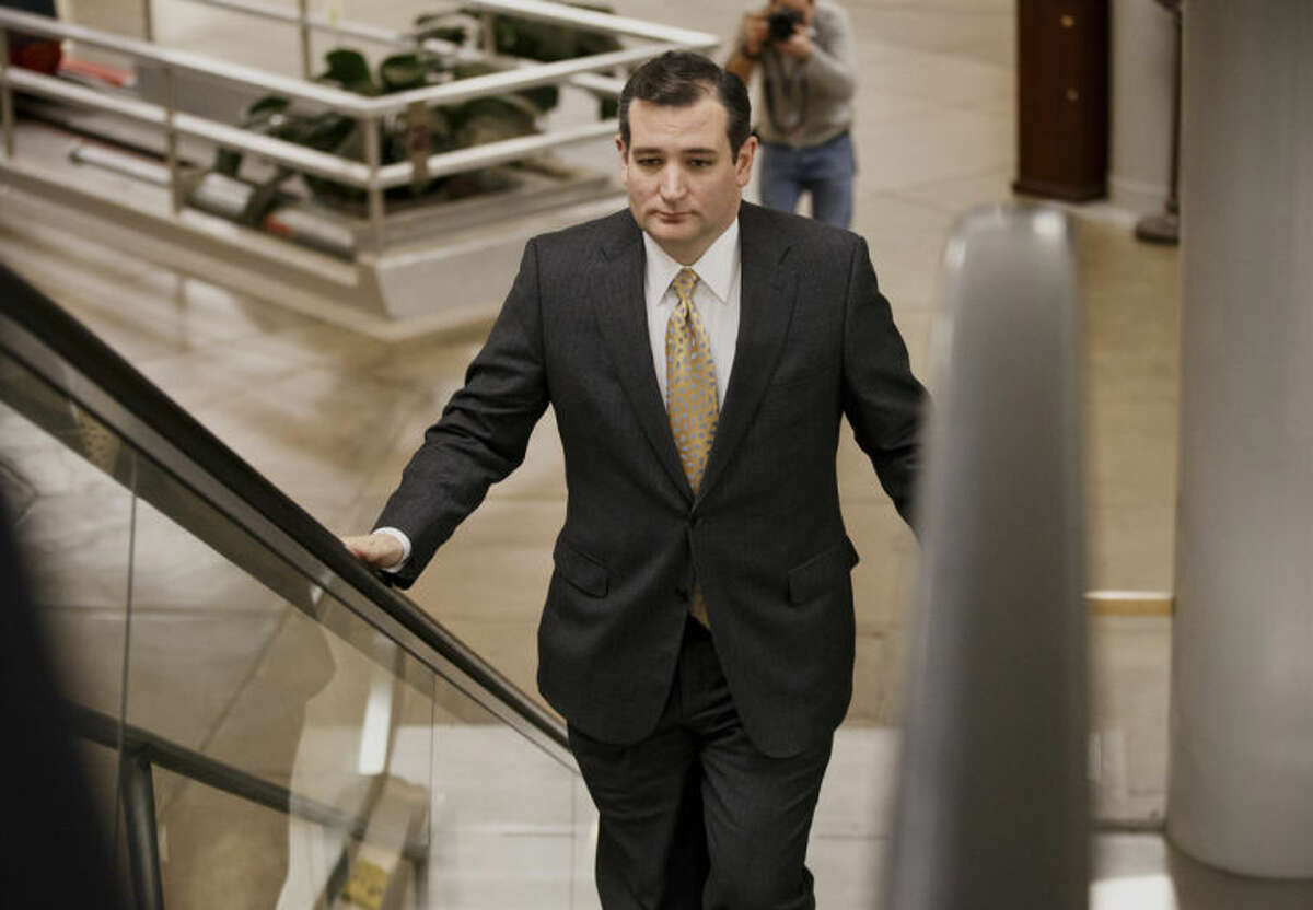 Sen. Ted Cruz, R-Texas arrives on Capitol Hill in Washington, Wednesday, Feb. 12, 2014, as senators go to the chamber for a vote to extend the Treasury's borrowing authority. Congress appears on track to send President Barack Obama must-do legislation to extend Treasury's borrowing authority without any concessions from the White House. (AP Photo/J. Scott Applewhite)