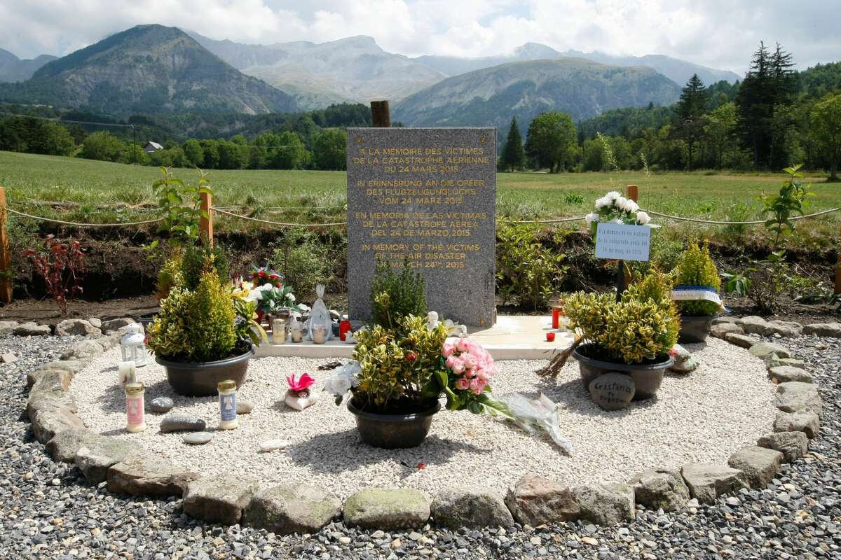 FILE - In this July 24, 2015 file picture a stele, a stone slab erected as a monument, set up in the area near where a Germanwings aircraft crashed in the French Alps, in Le Vernet, French Alps. France's air accident investigation agency releases report into the March 2015 crash of the Germanwings jet on March 13, 2016 . (AP Photo/Claude Paris,file)