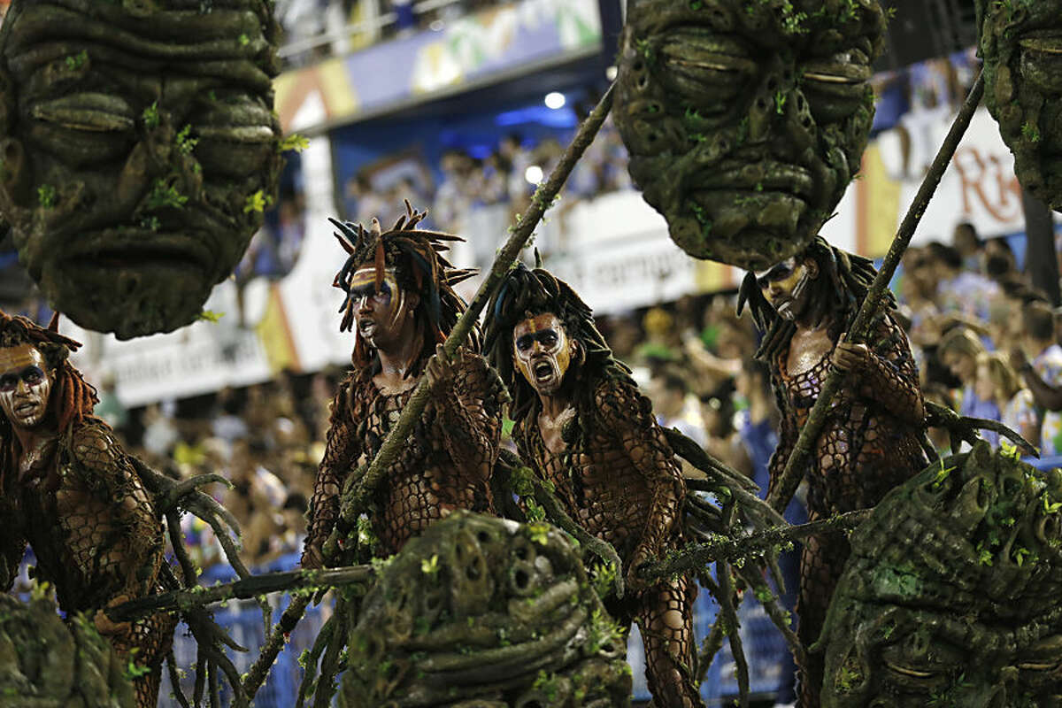 Performers from the Beija Flor samba school, parade during Carnival celebrations at the Sambadrome in Rio de Janeiro, Brazil, Tuesday, Feb. 17, 2015. (AP Photo/Silvia Izquierdo)