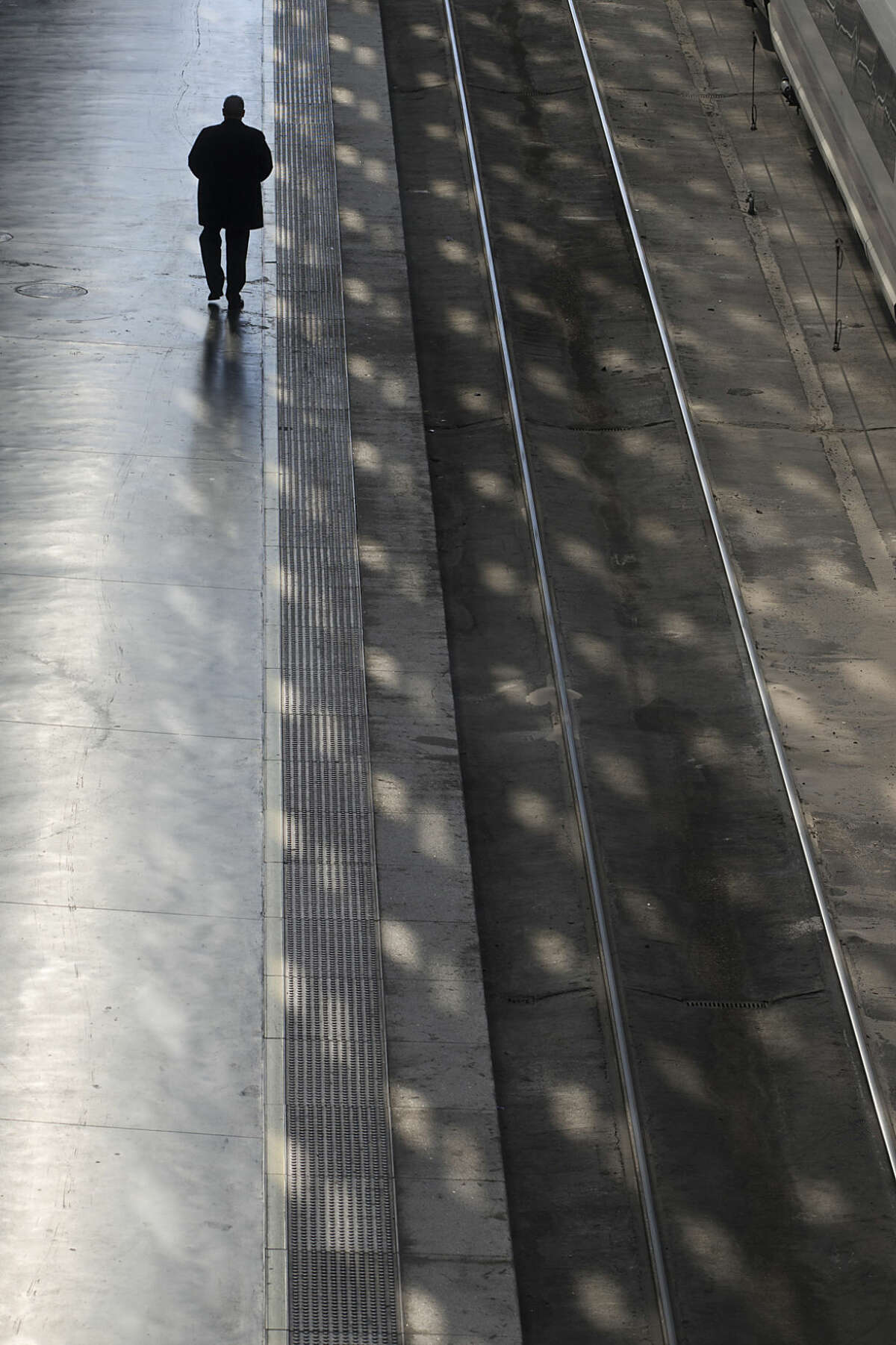 A man walks on a platform at Atocha train station in Madrid, Spain, Friday, March 11, 2016 Friday marks the 12th anniversary of Europe's worst Islamic terrorist attack which killed 191 people.The attackers targeted four commuter trains with 10 shrapnel-filled bombs concealed in backpacks during morning rush hour on March 11, 2004. (AP Photo/Paul White)