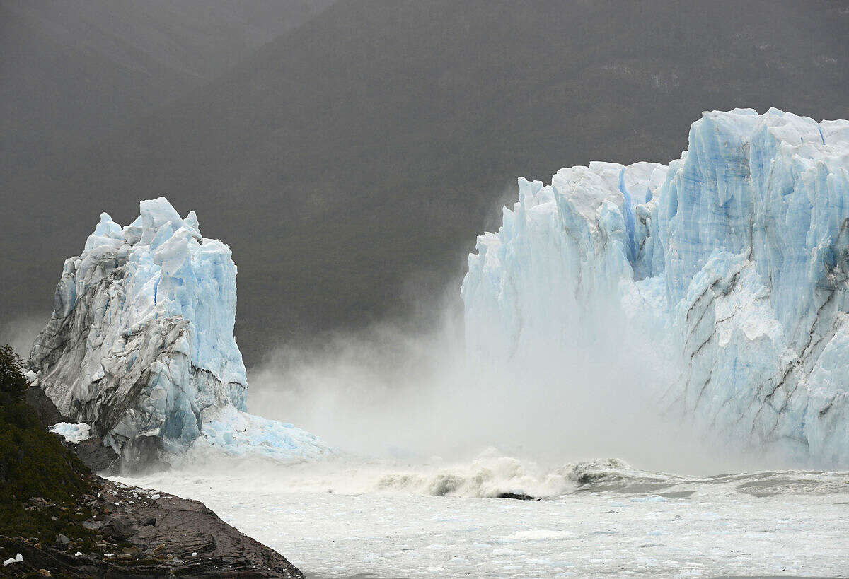 Mist rises from Lake Argentina, after the Perito Moreno Glacier's ice bridge collapsed into the lake at Los Glaciares National Park, near El Calafate, in Argentina's Patagonia region, Thursday, March 10, 2016. The massive natural monument in the province of Santa Cruz periodically advances over the lake, and then breaks off. The glacier last ruptured in March 2012. (AP Photo/Francisco Munoz)