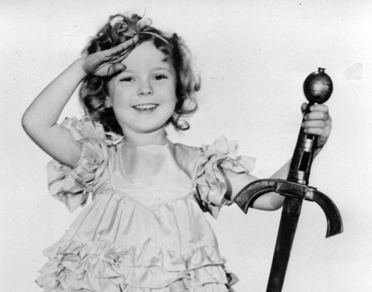 FILE - In this 1933 file photo, child actress Shirley Temple is seen in her role as "Little Miss Marker." Shirley Temple, the curly-haired child star who put smiles on the faces of Depression-era moviegoers, has died. She was 85. Publicist Cheryl Kagan says Temple, known in private life as Shirley Temple Black, died Monday night, Feb. 10, 2014, surrounded by family at her home near San Francisco. (AP Photo/File)