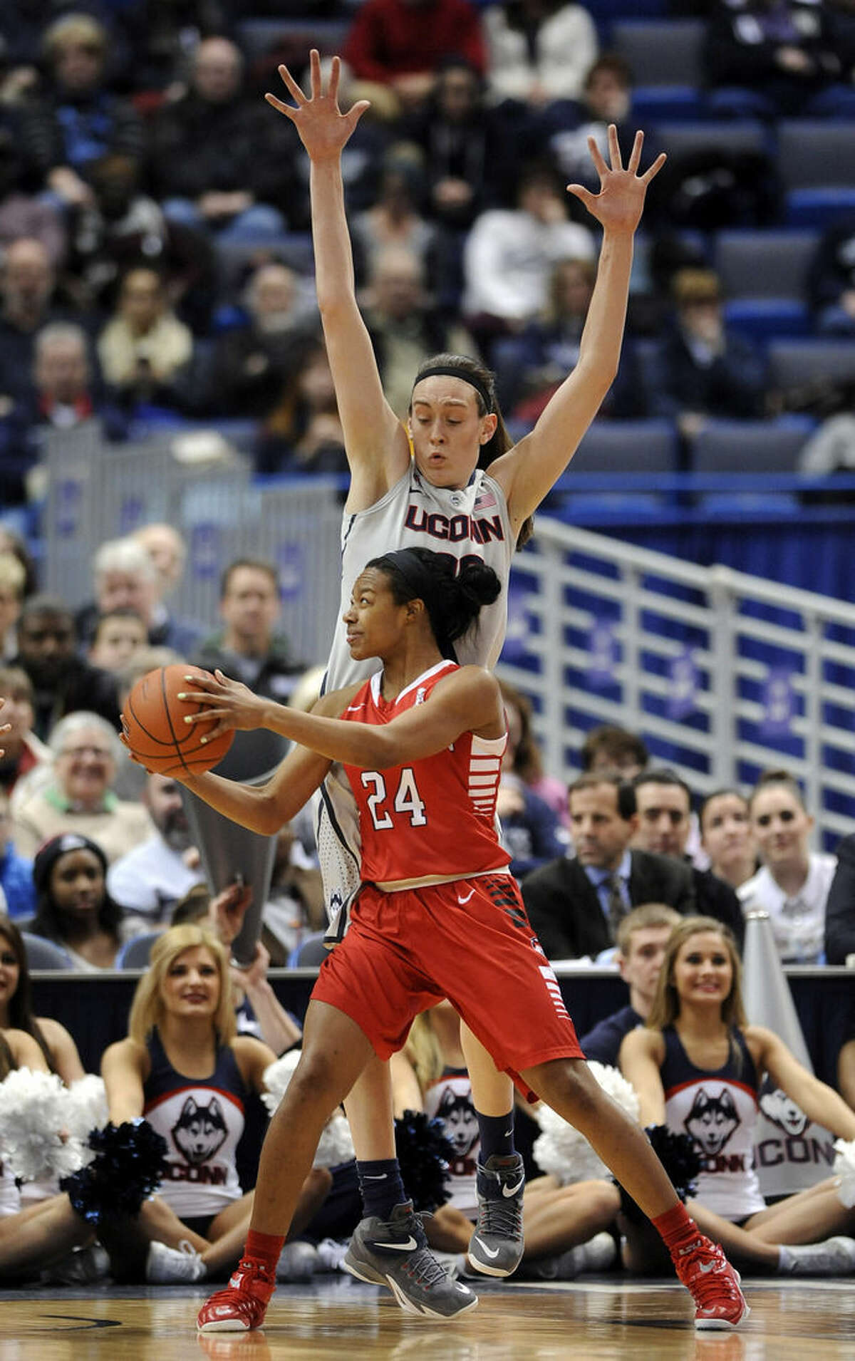 Connecticut's Breanna Stewart (30) guards Houston's Mariah Mitchell (24) during the first half of an NCAA college basketball game in Hartford, Conn., on Tuesday, Feb. 17, 2015. (AP Photo/Fred Beckham)