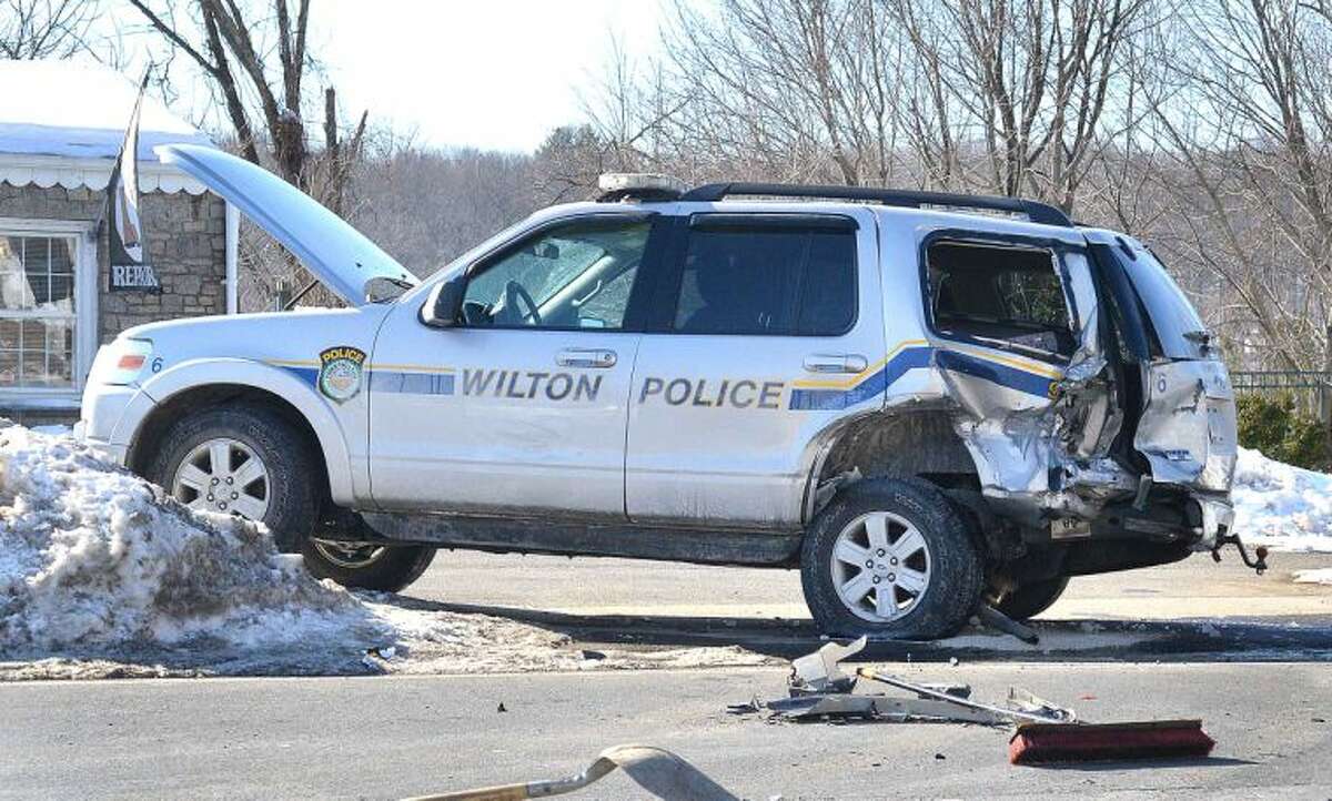 Hour Photo/Alex von Kleydorff Wilton Police investigate an accident involving one their SUV Police vehicles on Rt. 7 on Tuesday