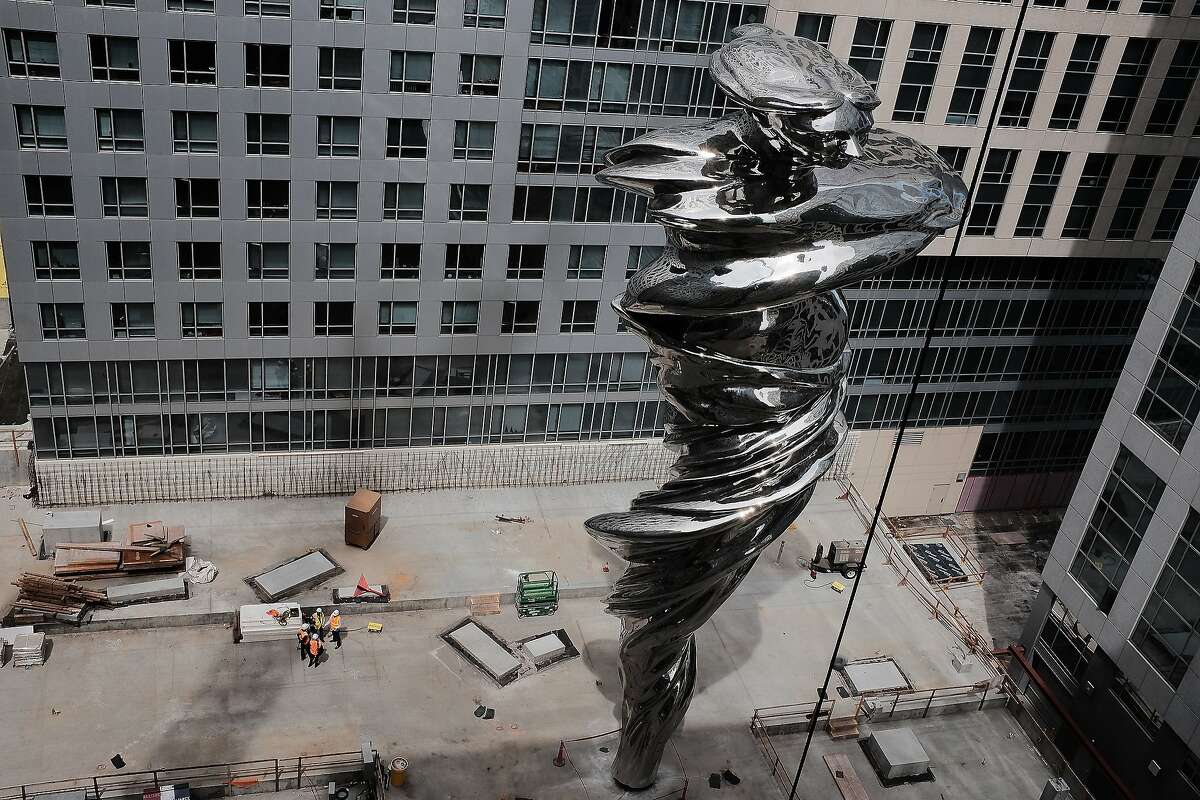 The newly completed sculpture "Venus," depicting goddess of love and beauty wrapped in a flowing robe, stands in Trinity Place in San Francisco. The 92-foot-tall work is by Lawrence Argent.