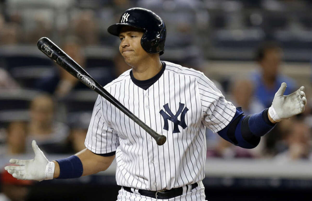 FILE - In this Aug. 13, 2013, file photo, New York Yankees' Alex Rodriguez reacts after striking out in the seventh inning of a baseball game against the Los Angeles Angels in New York. Rodriguez has accepted his season-long suspension from Major League Baseball, the longest penalty in the sport's history related to performance-enhancing drugs. Rodriguez withdrew his lawsuits against MLB, Commissioner Bud Selig and the players' association to overturn his season-long suspension on Friday, Feb. 7, 2014. (AP Photo/Kathy Willens, File)